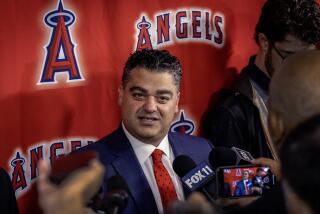 Anaheim, CA - November 15: Angeles general manager Perry Minasian answers reporters' questions.