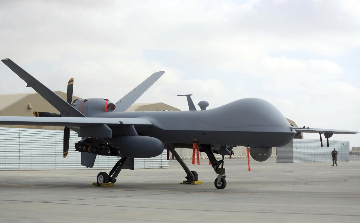 A U.S. MQ-9 drone aircraft sits on a tarmac.