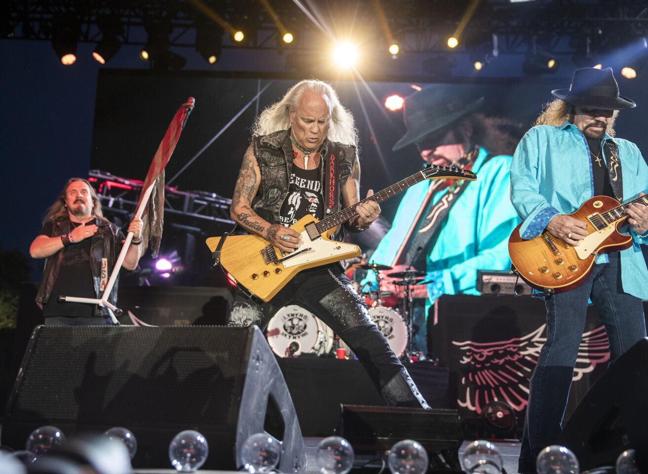 Lynyrd Skynyrd vocalist Johnny Van Zant, left, and guitarists Rickey Medlocke, center, and Gary Rossington (the band's sole continuous member), perform on the Palomino Stage on the second of the three-day 2019 Stagecoach Country Music Festival, the world's biggest country music festival.