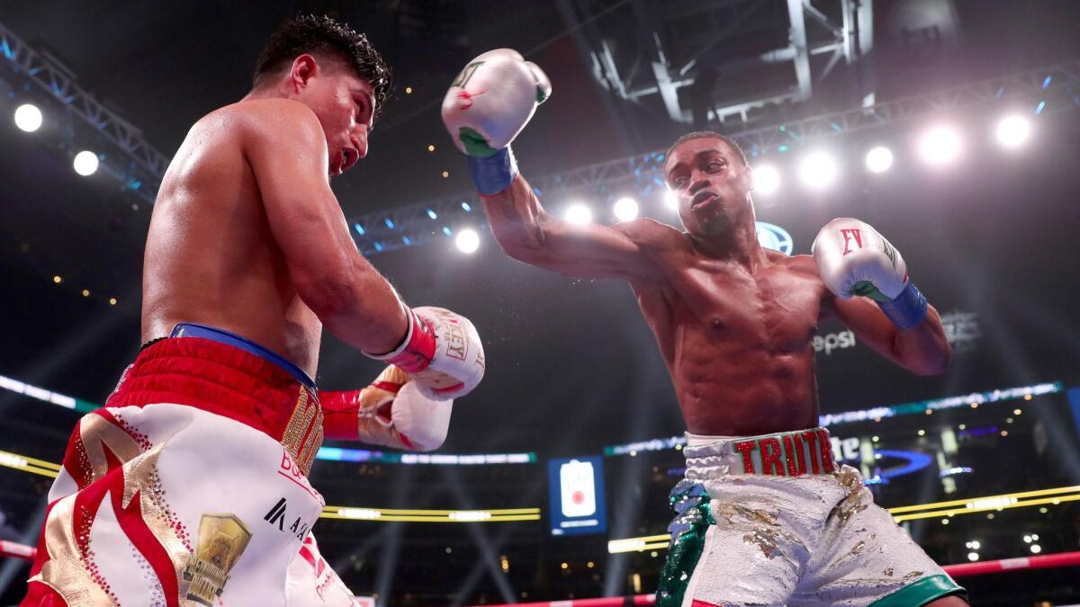 Errol Spence Jr. throws a punch during his welterweight title fight against Mikey Garcia on Saturday night.