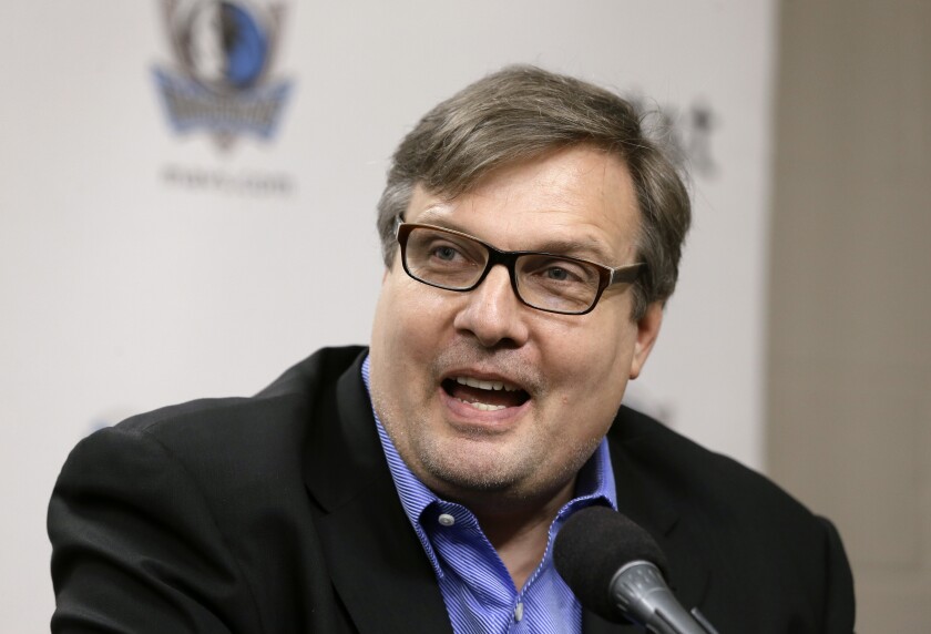 FILE - Dallas Mavericks general manager Donnie Nelson makes comments after introducing the NBA basketball team's three rookies during a news conference in Dallas, in this Wednesday, July 10, 2013, file photo. Mavericks general manager Donnie Nelson, instrumental in the club's acquisitions of Dirk Nowitzki and Luka Doncic, is leaving the organization after 24 seasons. The Mavericks said Wednesday, June 16, 2021, the club and Nelson agreed to part ways, with owner Mark Cuban saying the son of former coach Don Nelson was “instrumental to our success and helped bring a championship to Dallas.” (AP Photo/Tony Gutierrez, File)