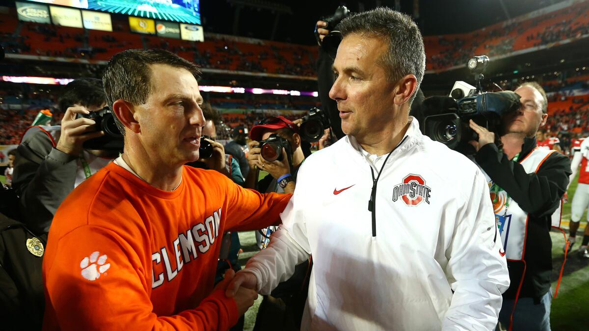 The last time Clemson played Ohio State, Tigers Coach Dabo Swinney, left, came out the winner over counterpart Urban Meyer in the Orange Bowl on Jan. 3, 2014.