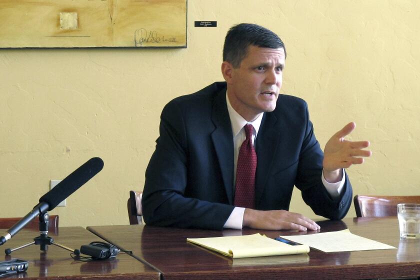 Troy Kelley takes questions at a news conference in Olympia, Wash., during his successful 2012 campaign for state auditor. In an indictment unsealed Thursday, a federal grand jury charged Kelley with filing false tax returns, obstruction of justice and possession of stolen property.