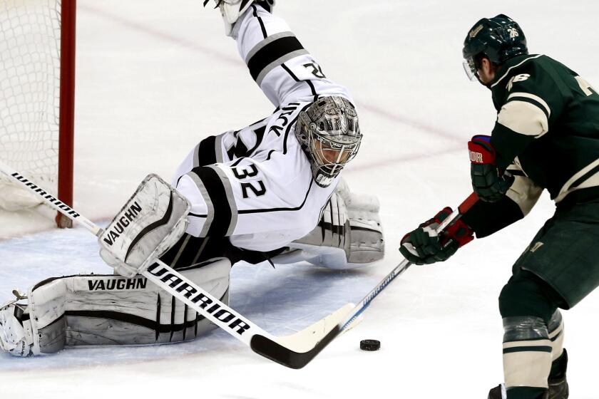Kings goalie Jonathan Quick stops a shot on a breakaway attempt by Wild right wing Nino Niederreiter in the first period Saturday in St. Paul, Minn.