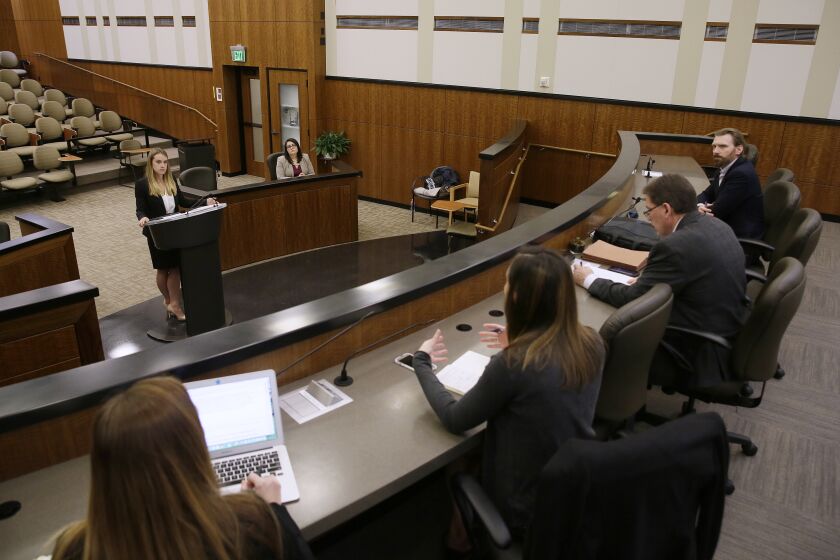 FILE - Student Michelle Freeman, top left, practices her argument in a moot courtroom at the University of California, Hastings College of the Law in San Francisco on March 13, 2017. California Gov. Gavin Newsom signed legislation Friday, Sept. 23, 2022, renaming the prominent law school in San Francisco founded by a 19th century rancher who sponsored deadly atrocities against Native Americans. (AP Photo/Eric Risberg, File)