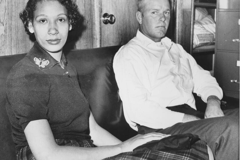 FILE - This Jan. 26, 1965 file photo shows Mildred Loving and her husband Richard P Loving. Bernard S. Cohen, who successfully challenged a Virginia law banning interracial marriage and later went on to a successful political career as a state legislator, has died. He was 86. Cohen and legal colleague Phil Hirschkop represented Richard and Mildred Loving, a white man and Black woman who were convicted of illegally cohabiting as man and wife and ordered to leave Virginia for 25 years(AP Photo, File)