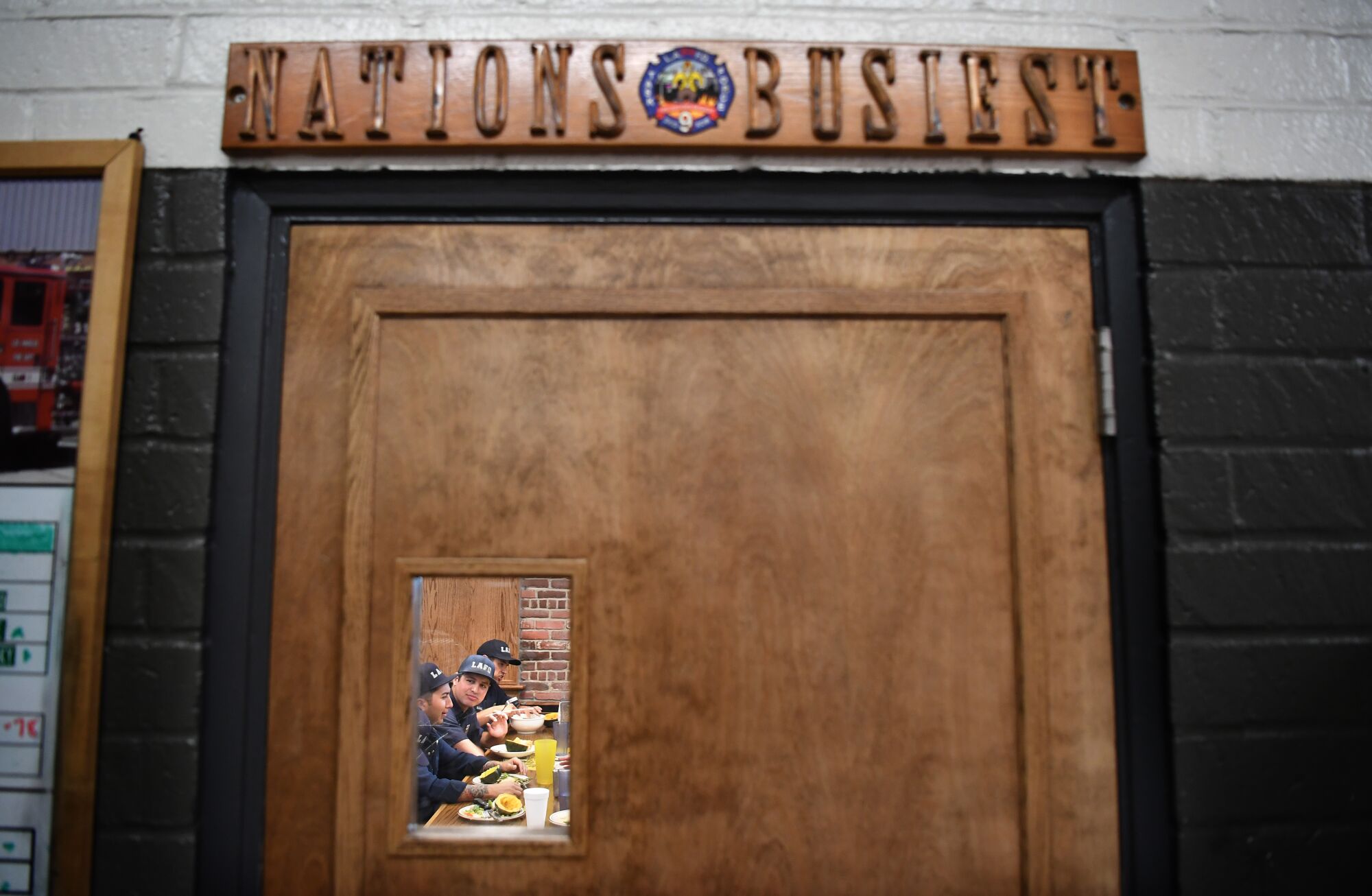 Los Angeles firefighters eat a meal at Fire Station No. 9
