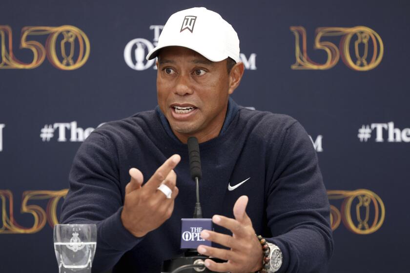 US golfer Tiger Woods speaks during a news conference ahead of the British Open on July 12 in St Andrews, Scotland.