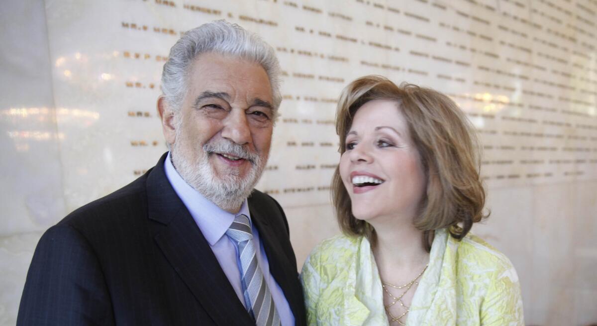 Renee Fleming and Placido Domingo share a laugh on Thursday at the Dorothy Chandler Pavilion in downtown Los Angeles.