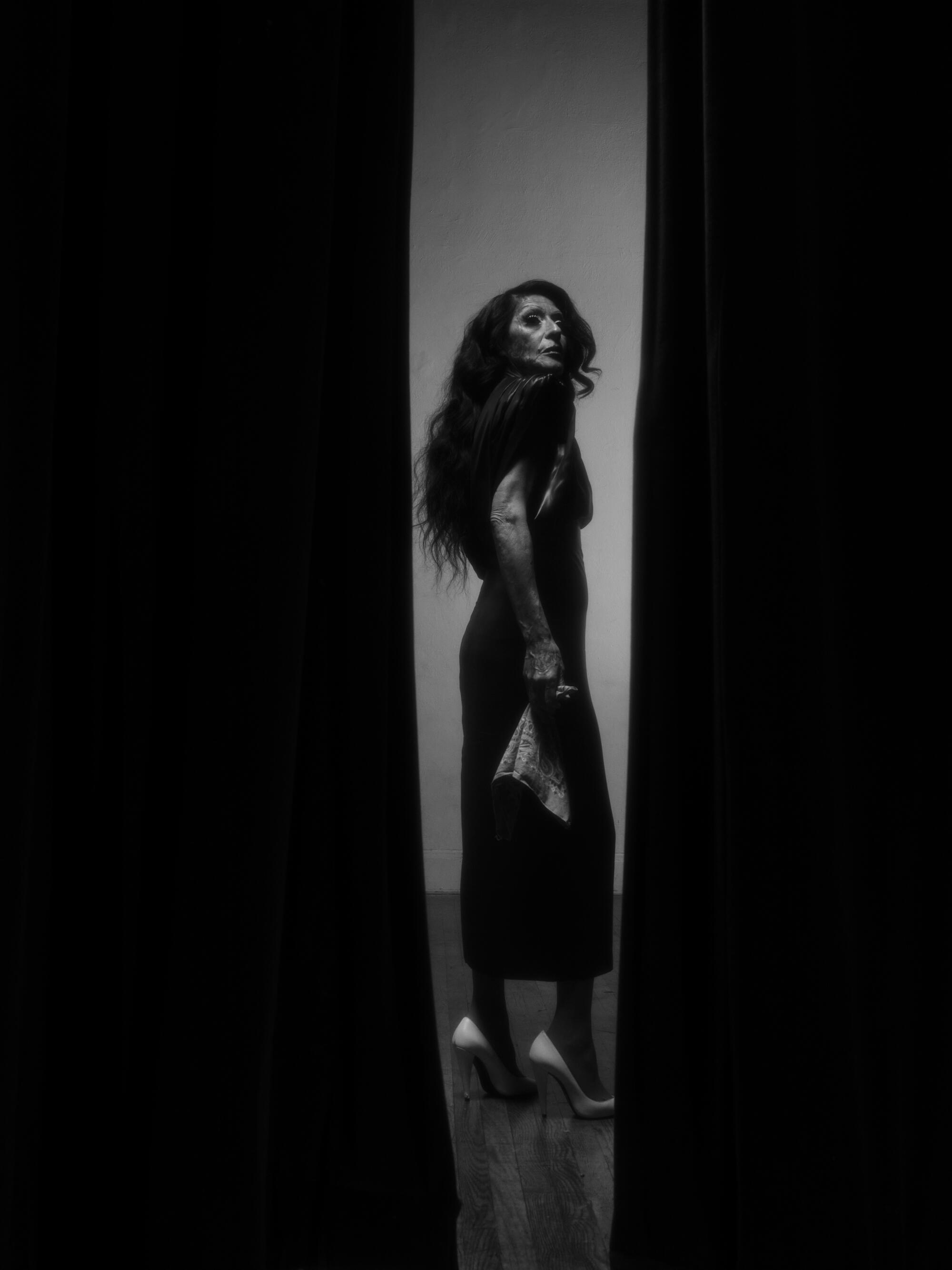 Rosie wears Versace dress, Saint Laurent heels.
