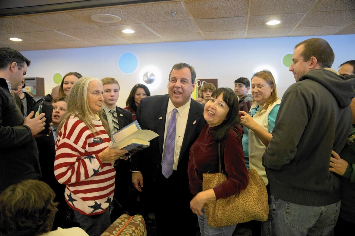 New Jersey Gov. Chris Christie mingles with supporters during a campaign event Monday in Council Bluffs, Iowa.