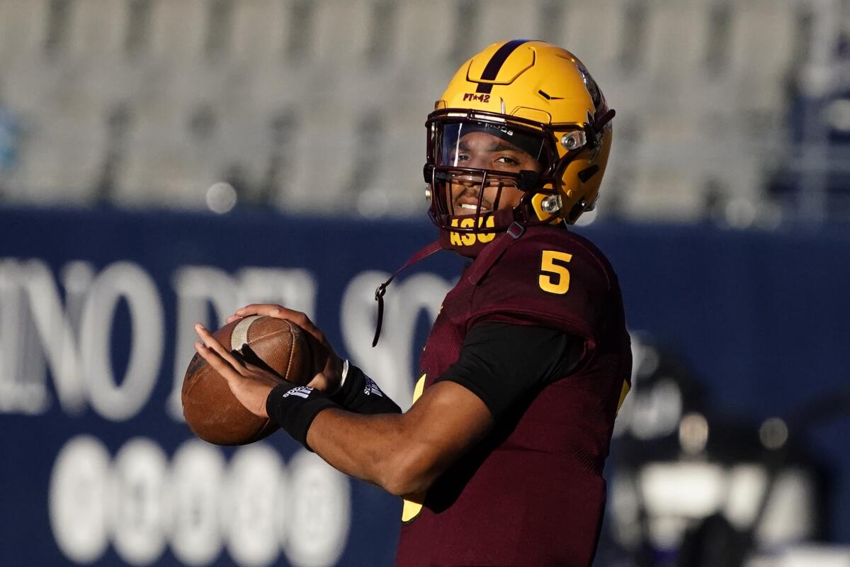 FILE - Arizona State quarterback Jayden Daniels (5) warms up before an NCAA college football game against Arizona in Tucsonm Ariz., in this Friday, Dec. 11, 2020, file photo. Daniels had a superb freshman season as Arizona State's starter, throwing for 2,748 yards and 17 touchdowns with two interceptions. (AP Photo/Rick Scuteri, File)