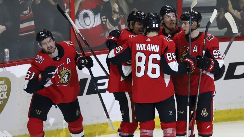 Ottawa Senators' Mark Stone (61) celebrates his goal against the Minnesota Wild with teammates during the third period on Saturday.