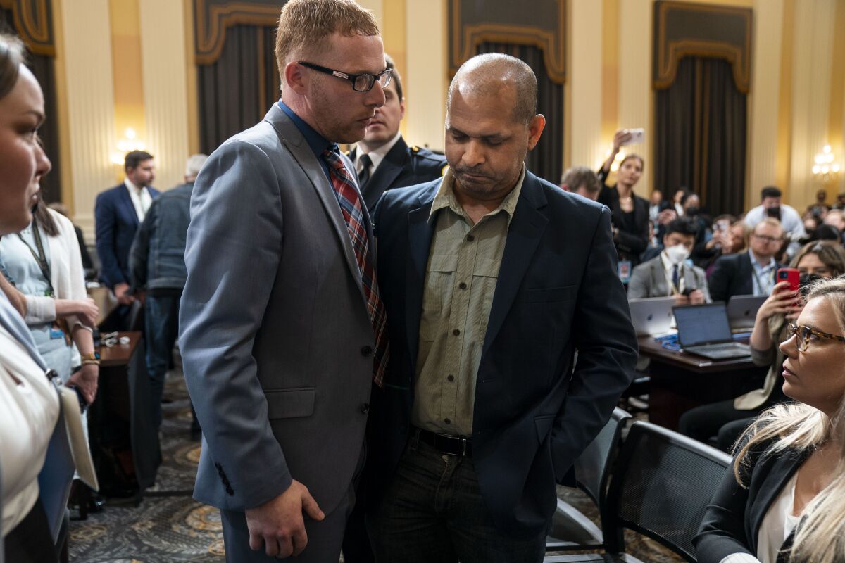 Stephen Ayres speaks with U.S. Capitol Police Sgt. Aquilino Gonell.