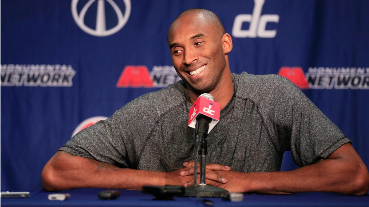 Kobe Bryant talks with the media during a news conference before the start of the Lakers and Washington Wizards.