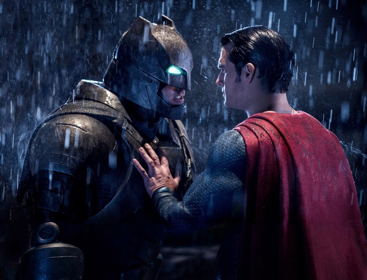 This image released by Warner Bros. Pictures shows Ben Affleck, left, and Henry Cavill in a scene from, "Batman v Superman: Dawn of Justice." Warner Bros. plans to feature the Batman and Superman characters in its Abu Dhabi theme park.