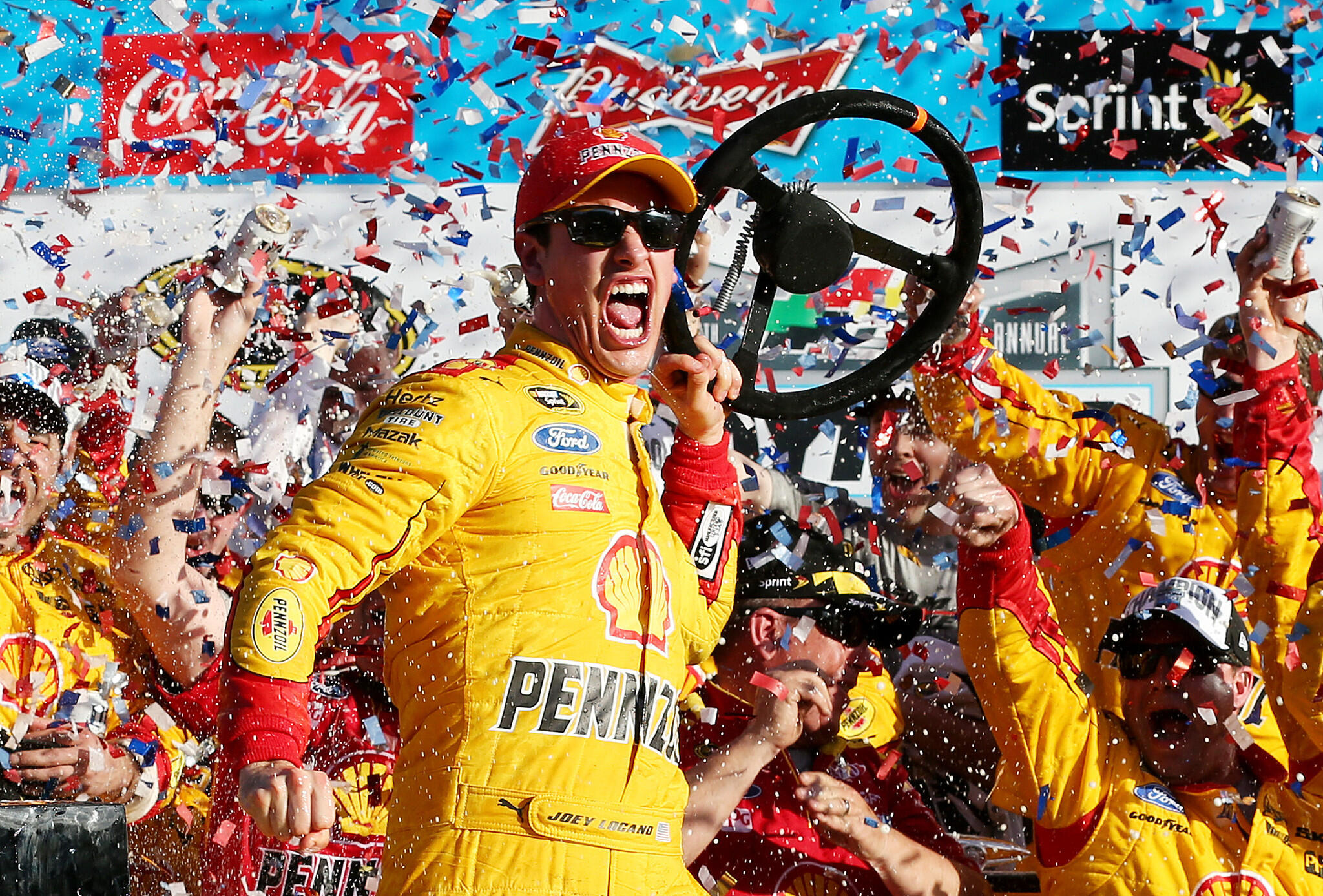 Joey Logano, driver of the #22 Shell Pennzoil Ford, celebrates in victory lane after winning the NASCAR Sprint Cup Series 57th Annual Daytona 500 at Daytona International Speedway on February 22, 2015 in Daytona Beach, Florida.