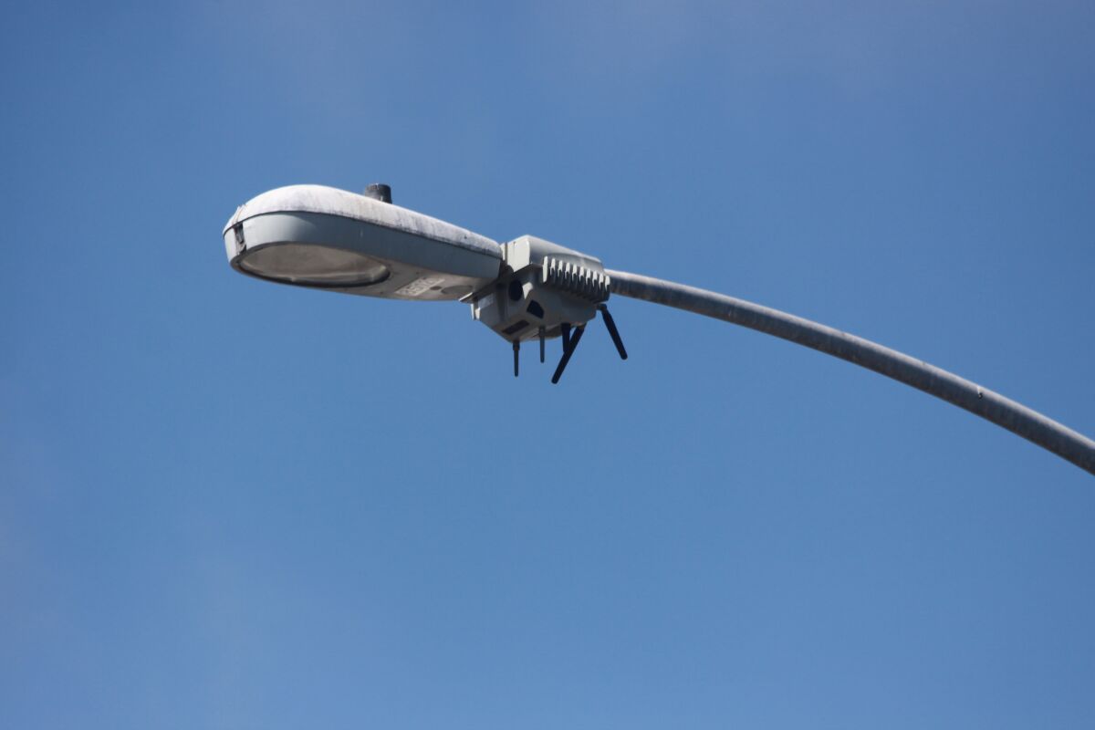 A "Smart Streetlight" or CityIQ sensor node is attached to a streetlight in La Jolla.