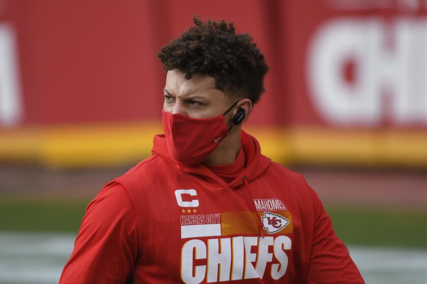 Kansas City Chiefs quarterback Patrick Mahomes walks on the field before an NFL divisional round football game against the Cleveland Browns, Sunday, Jan. 17, 2021, in Kansas City. (AP Photo/Reed Hoffmann)