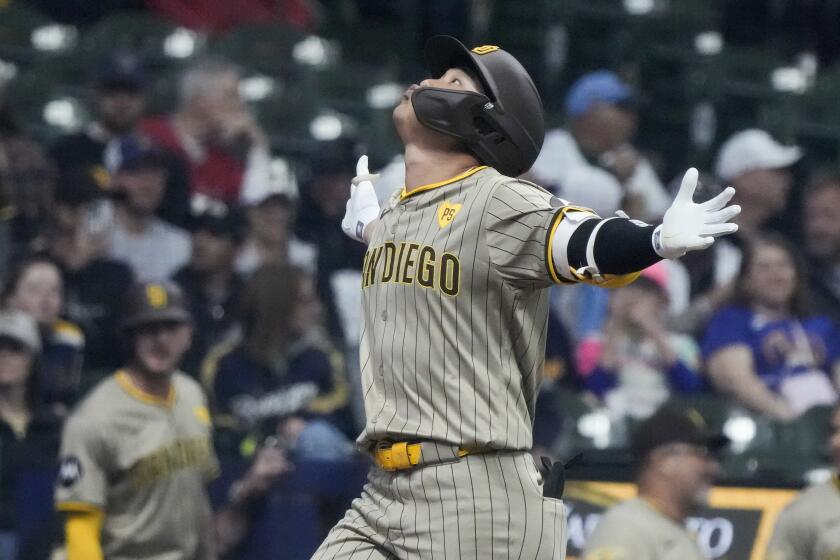 San Diego Padres' Ha-Seong Kim is celebrates after hitting a three-run home run during the first inning of a baseball game against the Milwaukee Brewers Tuesday, April 16, 2024, in Milwaukee. (AP Photo/Morry Gash)