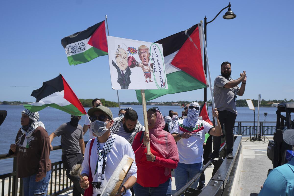 Protesters demonstrate against Israeli Prime Minister Benjamin Netanyahu's visit
