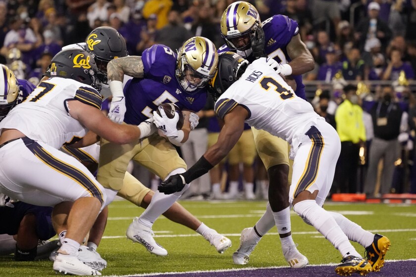 Washington scores a touchdown as they beat California in OT