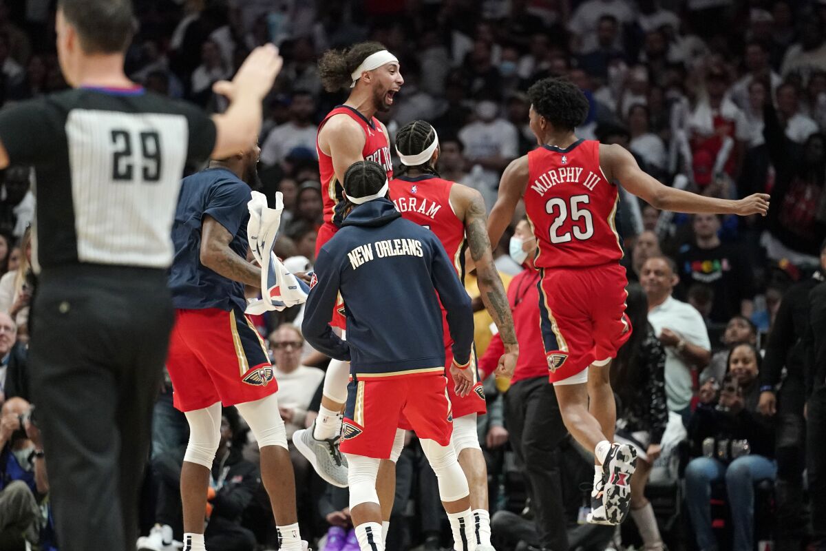 Members of the New Orleans Pelicans celebrate as time runs out in an NBA basketball play-in tournament game against the Los Angeles Clippers Friday, April 15, 2022, in Los Angeles. The Pelicans won 105-101. (AP Photo/Mark J. Terrill)