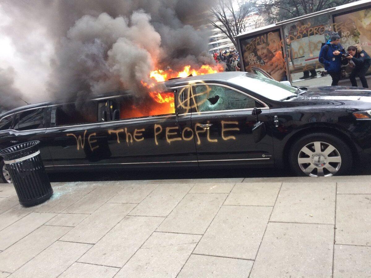 A limousine burns during Street protests in Washington on Friday.