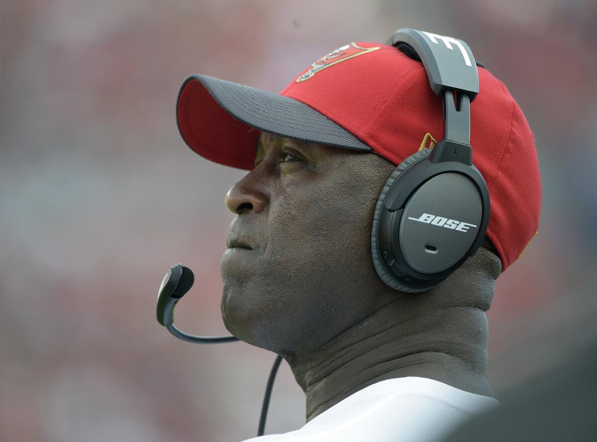 Buccaneers Coach Lovie Smith looks up at the scoreboard during the fourth quarter of a game against the Chicago Bears.