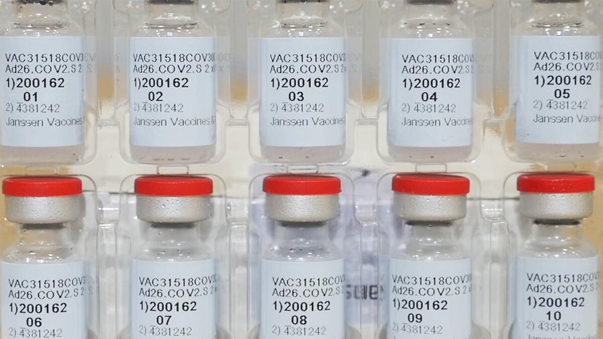 Stacked vials of COVID-19 vaccine.