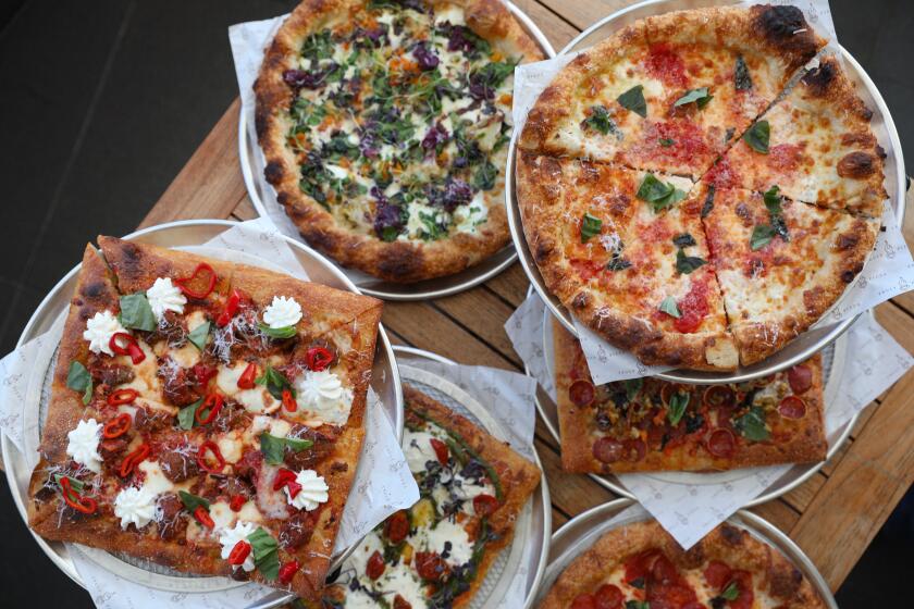 Truly Pizza in Dana Point offers hearth-baked pizza and square pies sometimes known as a "grandma slice."