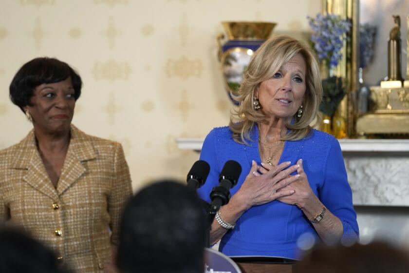 First lady Jill Biden, right, speaks as Robin Jackson, left, wife of Charles Jackson, pastor of Brookland Baptist Church in West Columbia, S.C., listens during a celebration of the Thanksgiving season with African American women faith leaders, community leaders and advocates from the Southeast, in the Blue Room of the White House in Washington, Monday, Nov. 13, 2023. (AP Photo/Susan Walsh)
