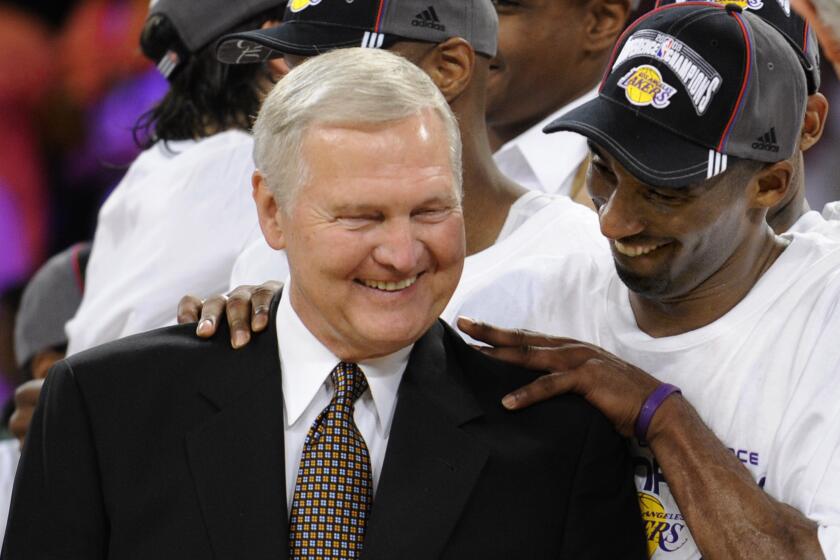 FILE - Los Angeles Lakers' Kobe Bryant gives basketball great Jerry West a shoulder rub after the Lakers beat the San Antonio Spurs 100-92 in Game 5 of the NBA Western Conference basketball finals, May 29, 2008, in Los Angeles. (AP Photo/Kevork Djansezian, File)