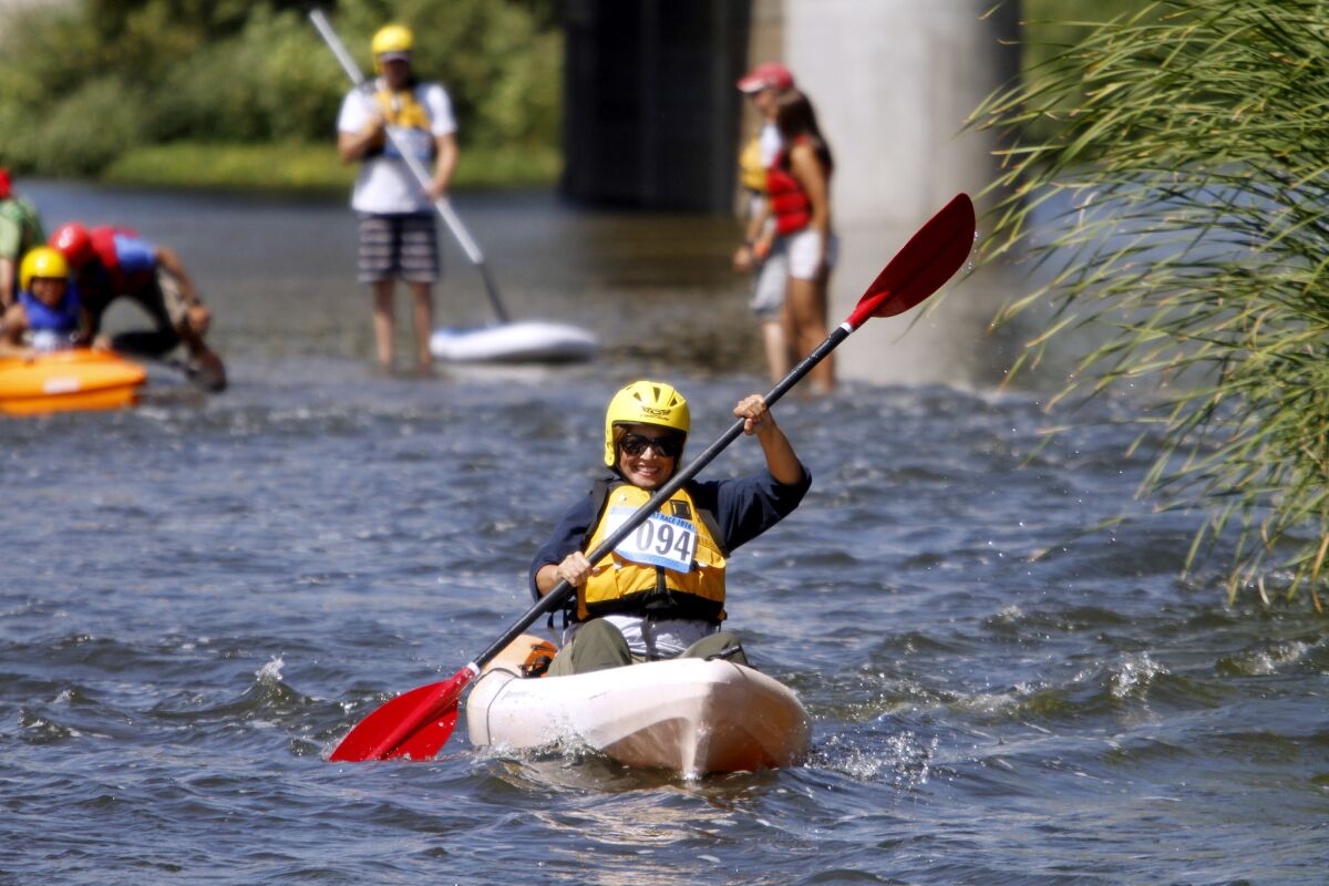 A participant heads down river in the L.A. River Expeditions first annual L.A. River boat race at Rattlesnake Park just south of Fletcher Drive in L.A. on Saturday, Aug. 30, 2014.