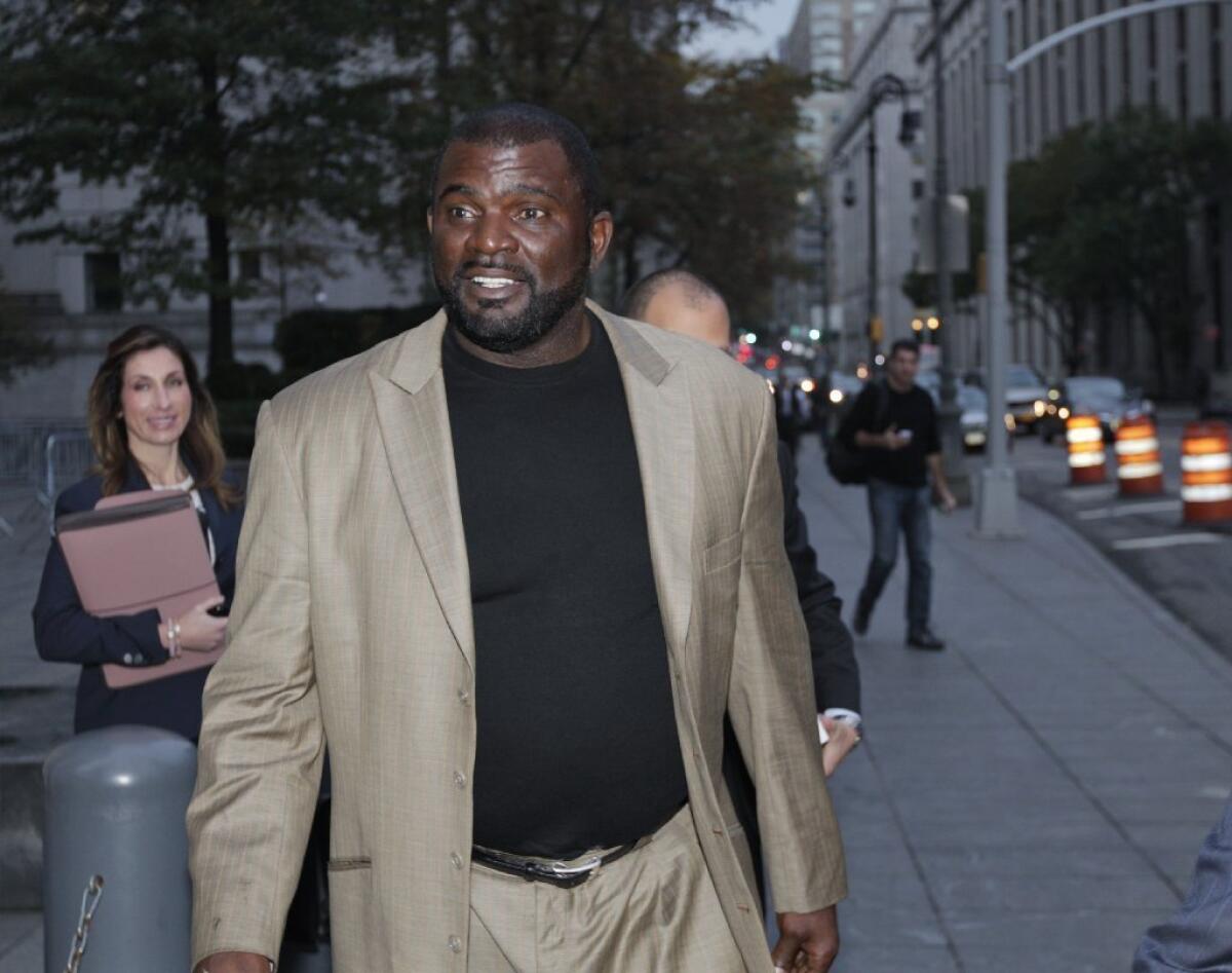 Former New York Giants linebacker Lawrence Taylor leaves federal court Tuesday.