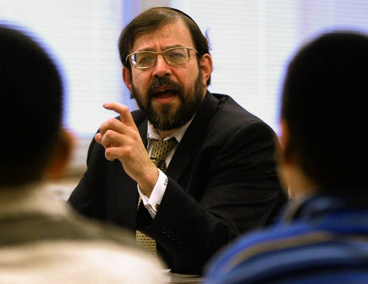 Rabbi S. Binyomin Ginsberg, shown in 2003, sued Northwest Airlines for canceling his frequent-flier account status. After an appellate court upheld his claim, it went to the Supreme Court, which heard arguments Tuesday.