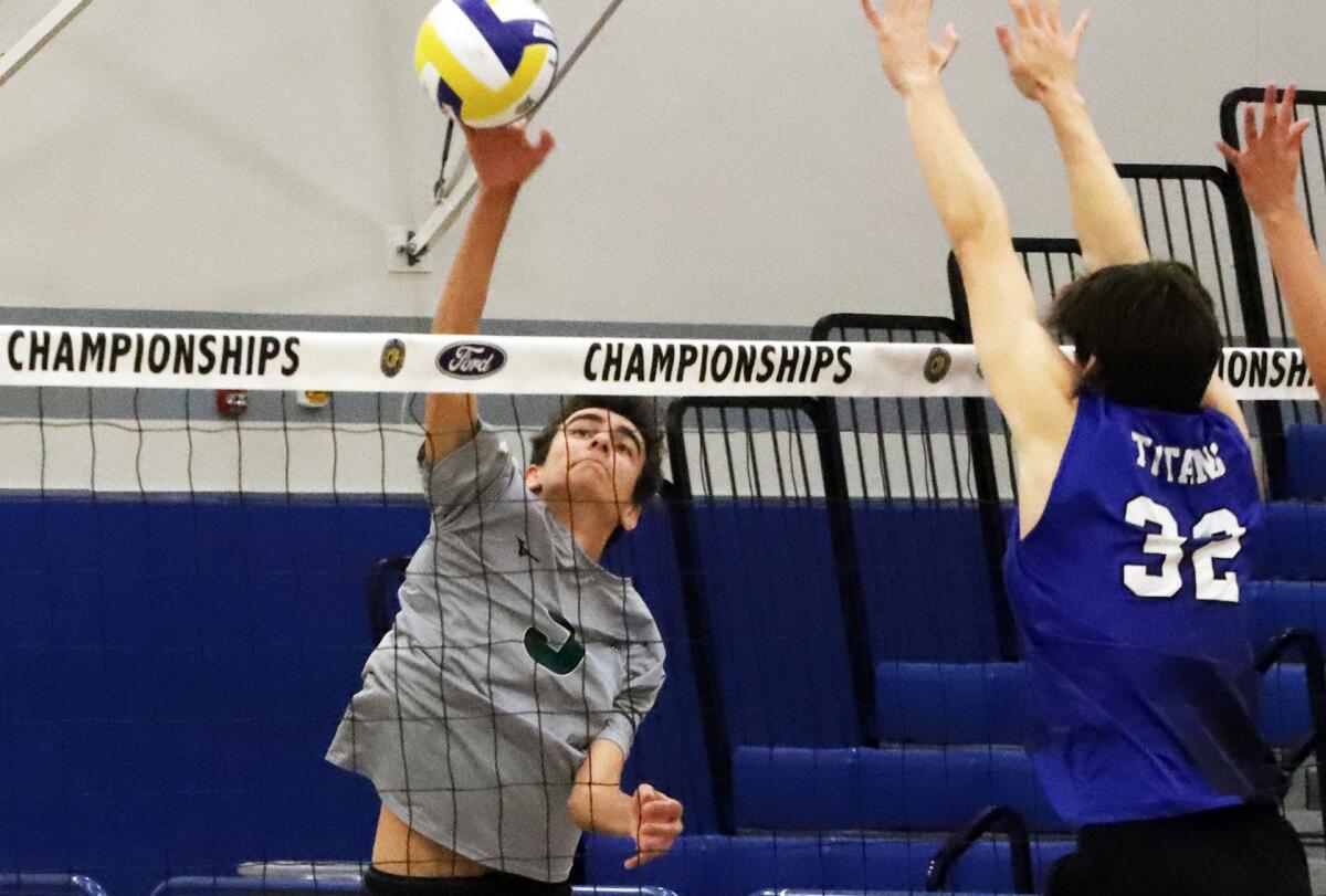 Sage Hill's Ryan Manesh (5) spikes the ball against San Marino in the CIF Southern Section Division 5 final on Saturday.