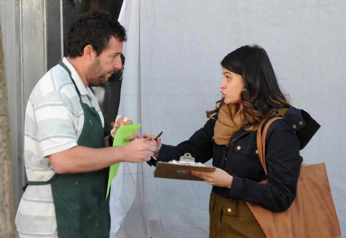 Adam Sandler and Melonie Diaz on the set of "The Cobbler."