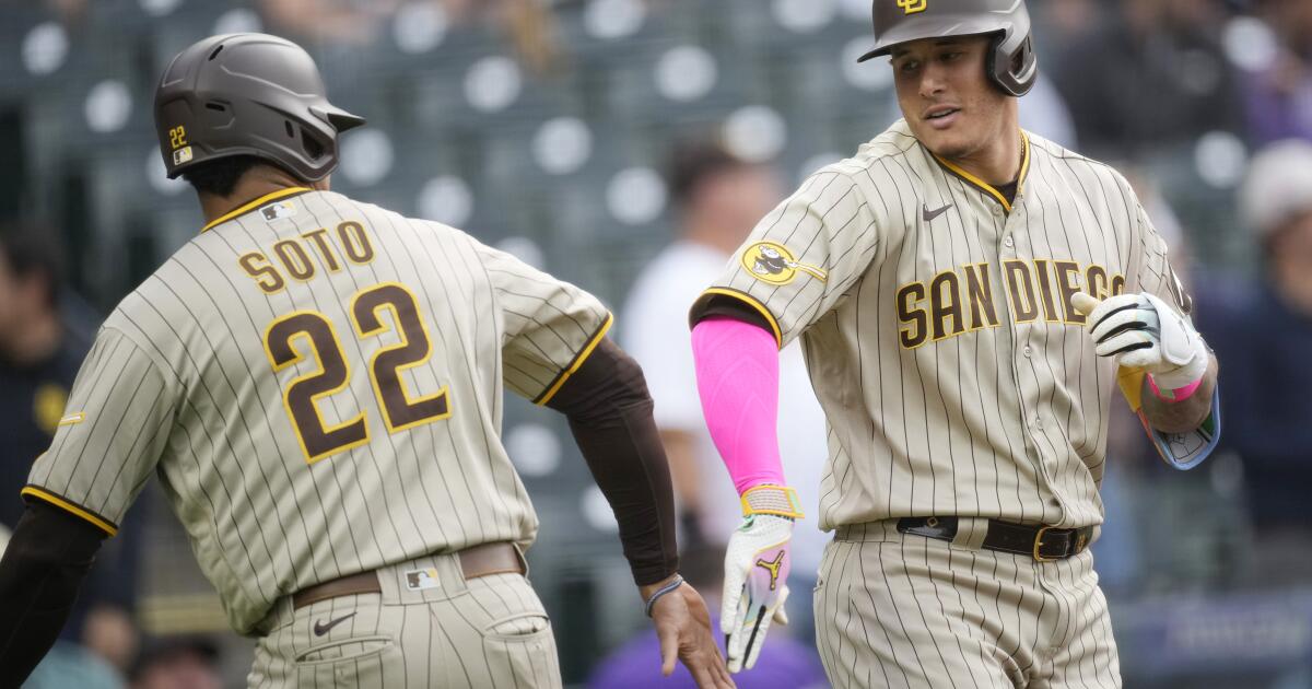 Nick Martinez and Austin Nola of the San Diego Padres smile at the