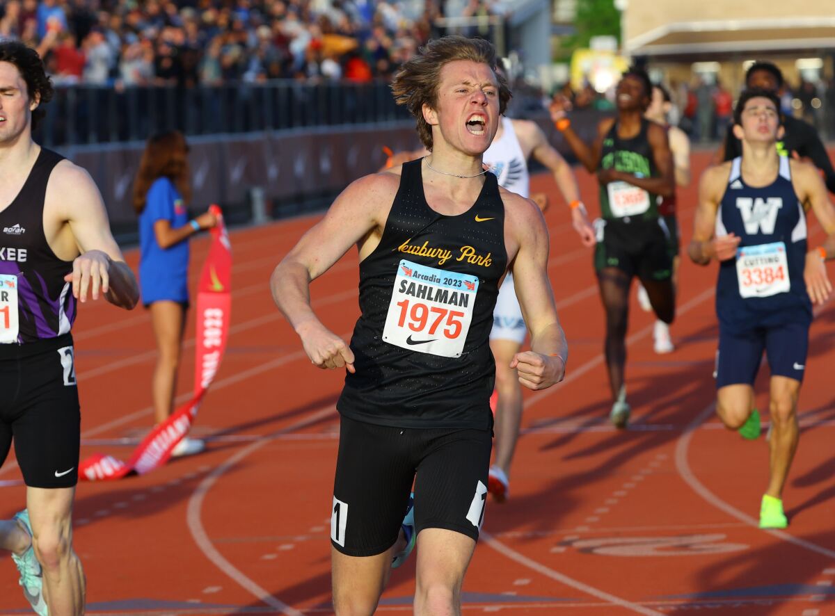 Aaron Sahlman of Newbury Park celebrates after winning the 800-meter race at the Arcadia Invitational.