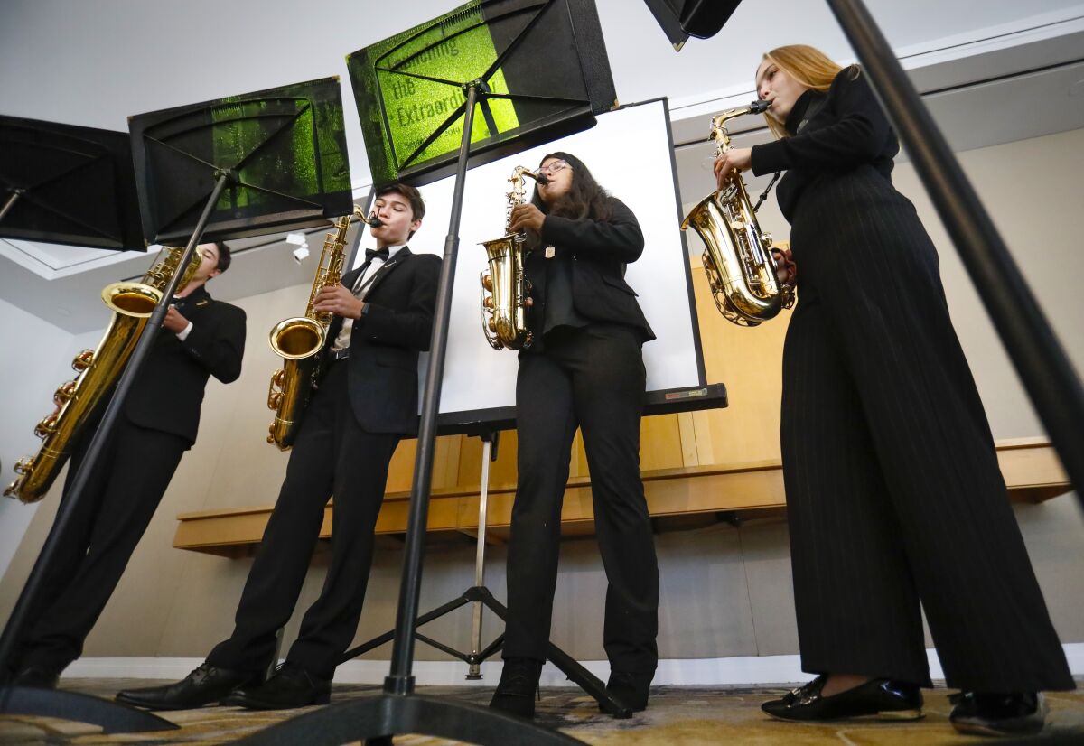Members of the Rancho Buena Vista High School Saxophone Quartet, Aidan Sanchez, left, Kaito Garcia, Nadine Alvarez, and Kylie MacLean, right, perform at the California Center for the Arts, Escondido, September 13, 2019, during the CREATE 78 meeting, a collaboration between local school districts, colleges and businesses to enhance arts education in schools across North County.