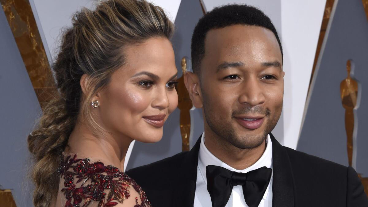 Chrissy Teigen and John Legend at the Academy Awards in February 2016.