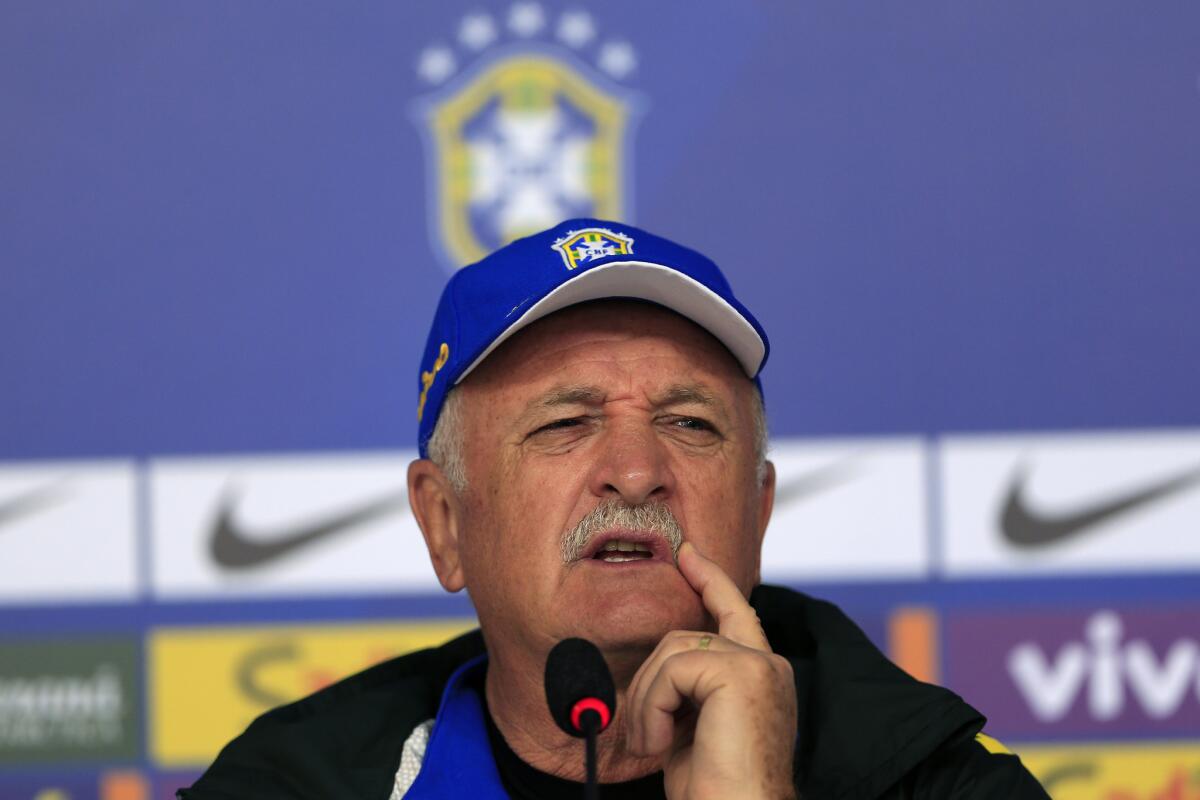 Brazilian World Cup Coach Luiz Felipe Scolari answers questions at a June 5 news conference.