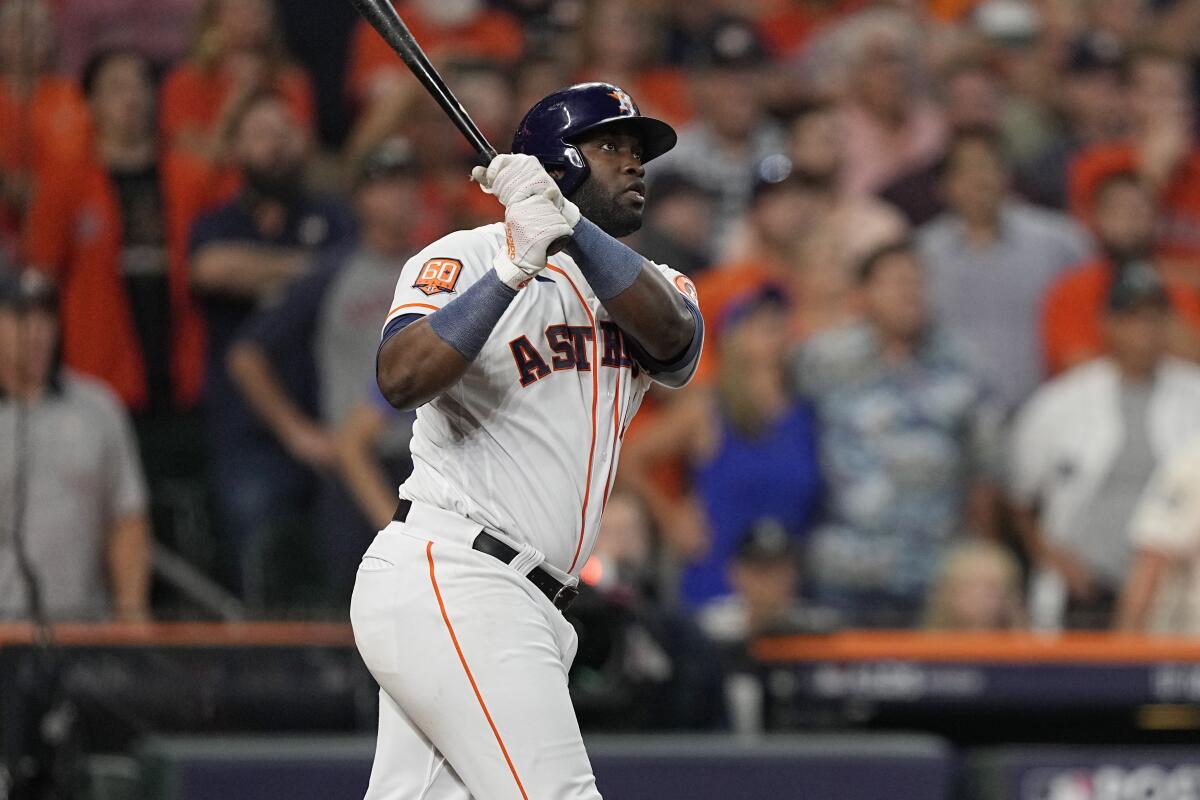 The Astros' Yordan ?lvarez watches his three-run, walk-off home run in Game 1 of the ALDS on Oct. 11, 2022.