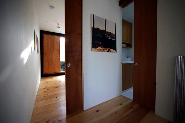 Upstairs, pocket doors divide rooms without impeding the free-flowing floor plan.