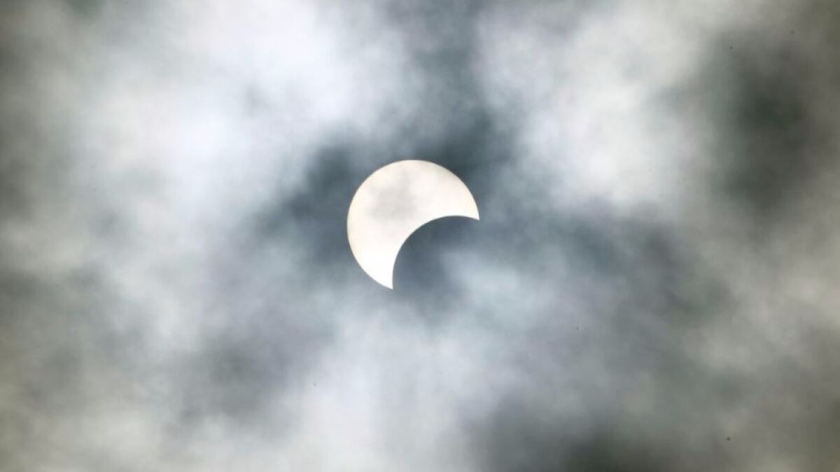 A partial solar eclipse as seen from Abidjan, Ivory Coast, on Thursday.