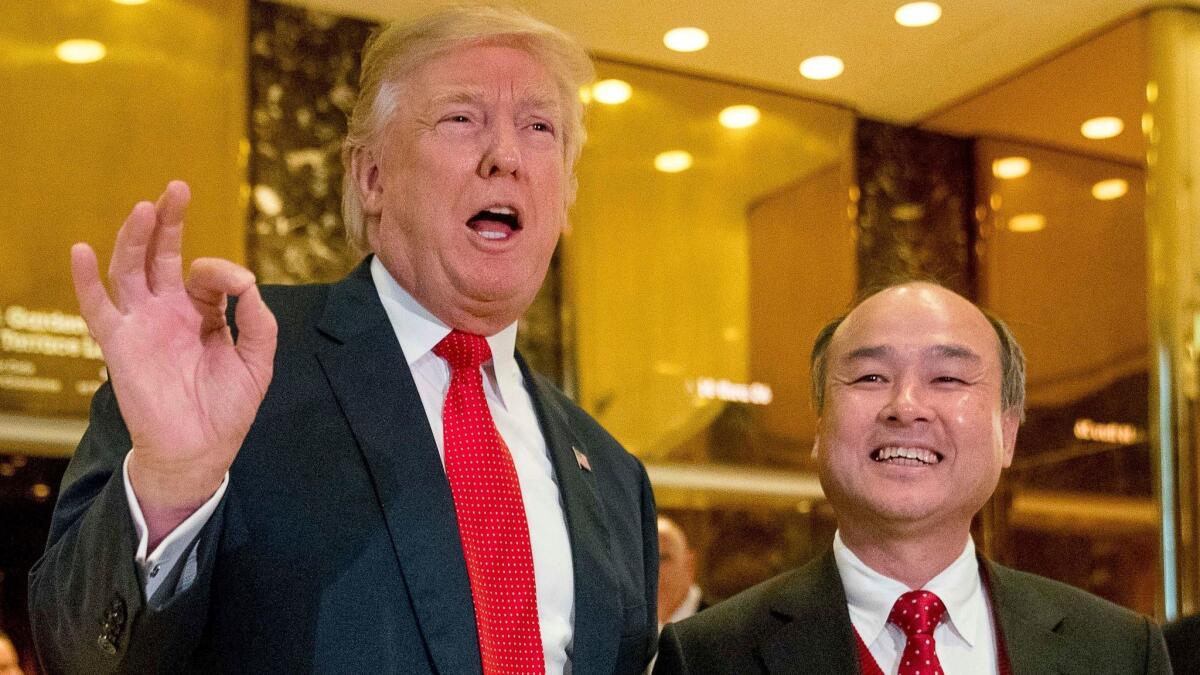 President-elect Donald Trump and SoftBank CEO Masayoshi Son make their announcement at Trump Tower in New York on Dec. 6.