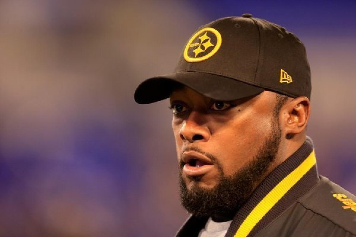 Steelers Coach Mike Tomlin's actions during Pittsburgh's Thanksgiving Day loss to Baltimore have been called into question after the coach wandered into the path of Ravens return man Jacoby Jones.