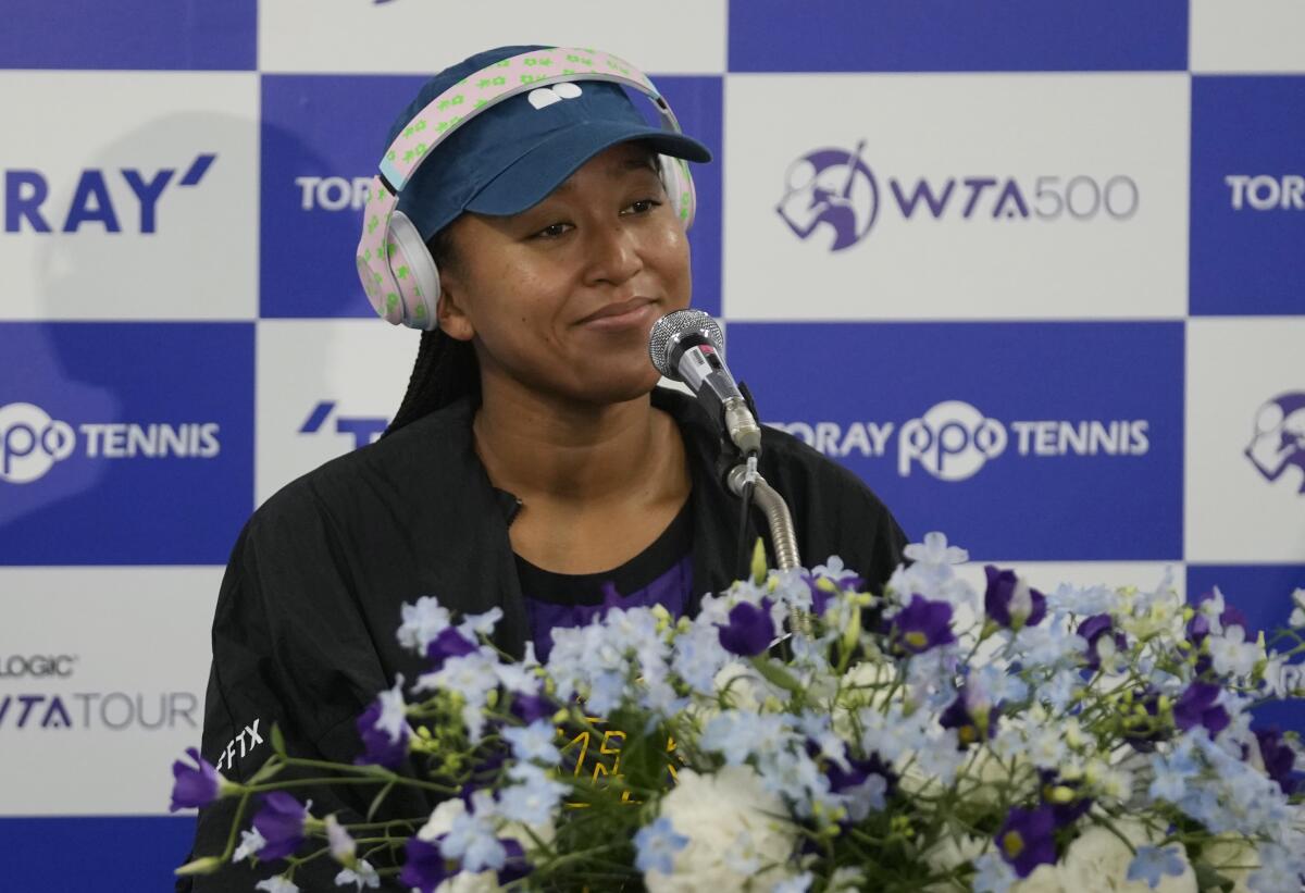 Naomi Osaka of Japan listens to a question during a news conference at the Pan Pacific Open tennis tournament
