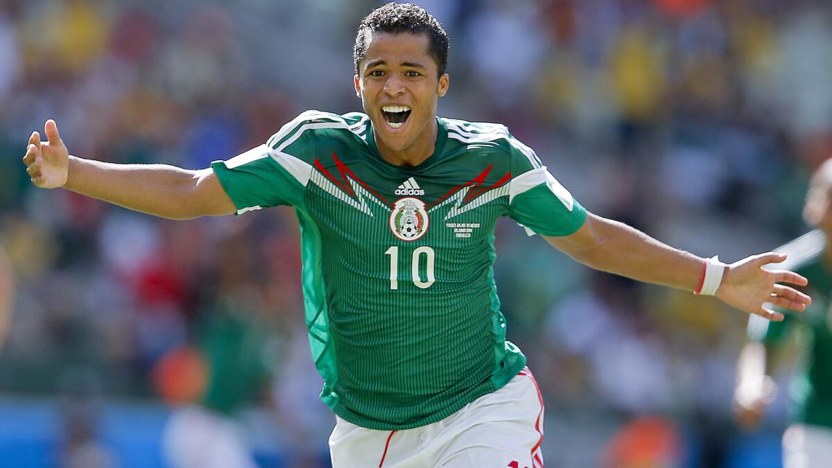 Mexico midfielder Giovani dos Santos celebrates after scoring against the Netherlands in the second round of the World Cup on June 29, 2014, in Fortaleza, Brazil.